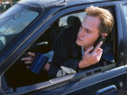 Man driving with telephone